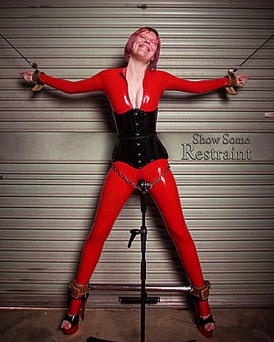 Foxxy having a fun time in the red latex catsuit.'