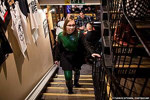 In A Crowded Pub, Wearing A Latex Catsuit'