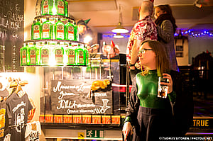 A Chandelier Made Out Of Jägermeister And A Green Catsuit In A Pub'