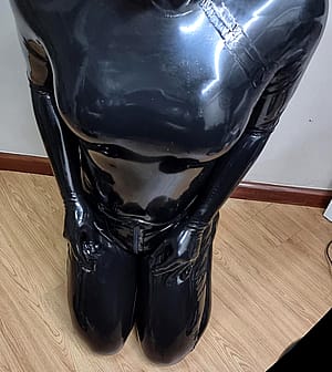 Kneeling Down And Waiting In Full Latex'